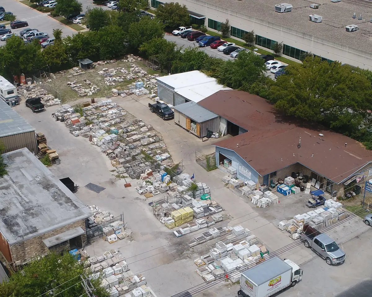 Aerial view of the Tedford yard on United Drive, with pallets of tile stacked behind the showroom